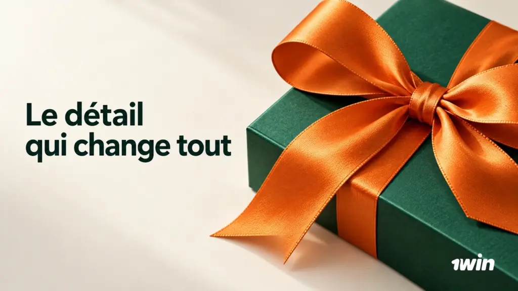 Coffret vert avec un ruban orange.